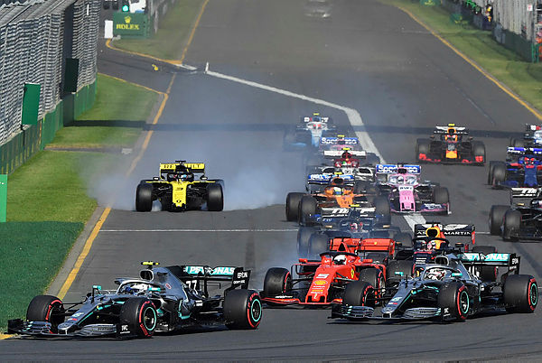 Mercedes’ Finnish driver Valtteri Bottas (L) leads a pack at the start of the Australian Grand Prix in Melbourne — AFP