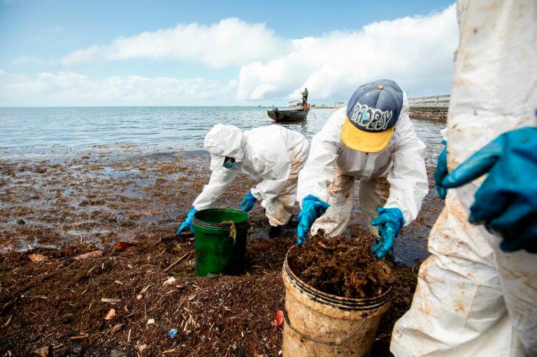 Workers continue to clean up two months after an oil spill threatened Mauritius natural wonders, sparking outrage. — AFP