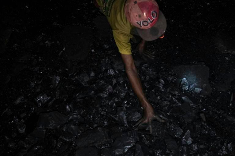 Miners manually hew coal and drag it up to the surface, where it sells for just $35 per tonne. — AFP