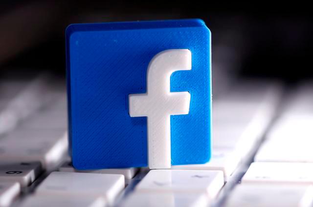 A 3D-printed Facebook logo is seen placed on a keyboard in this illustration taken March 25, 2020. — Reuters