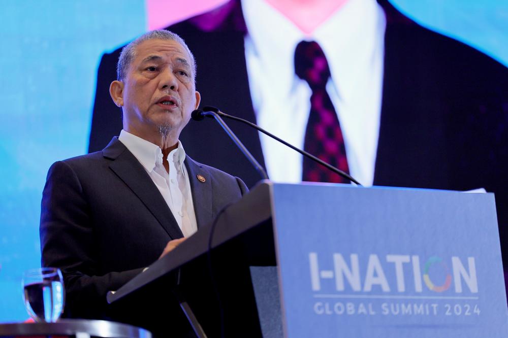 Fadillah delivering his keynote speech at the I-Nation Global Summit 2024 in Kuala Lumpur today. – Bernamapic