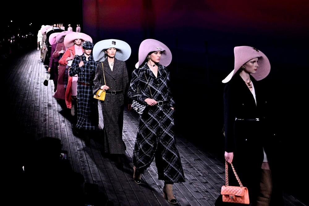 Models present creations by Chanel for the Women Ready-to-wear Fall-Winter 2024/2025 collection as part of the Paris Fashion Week, in Paris on March 5, 2024/AFPpix