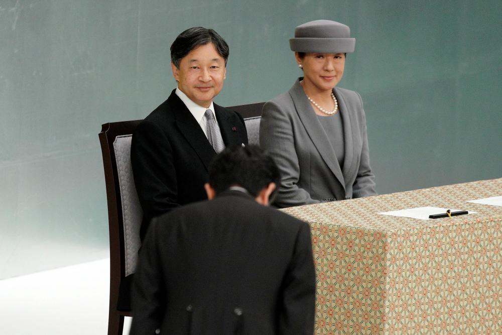 Japanese Emperor Naruhito, and Empress Masako, look at Japanese Prime Minister Shinzo Abe bowing during a memorial ceremony for the war dead at Nippon Budokan Martial Arts Hall in Tokyo Thursday, Aug. 15, 2019. Japan marked Thursday the 74th anniversary of the end of World War II. — AFP