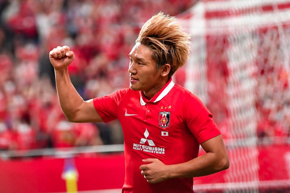 Urawa's Takahiro Akimoto celebrates scoring a goal during the AFC Champions League quarter-final football match between Thailand's BG Pathum United and Japan's Urawa Red Diamonds in Saitama on August 22, 2022. - AFPPIX