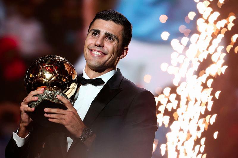 Manchester City's Spanish midfielder Rodri receives the Ballon d'Or award during the 2024 Ballon d'Or France Football award ceremony at the Theatre du Chatelet in Paris on October 28, 2024. - AFPPIX