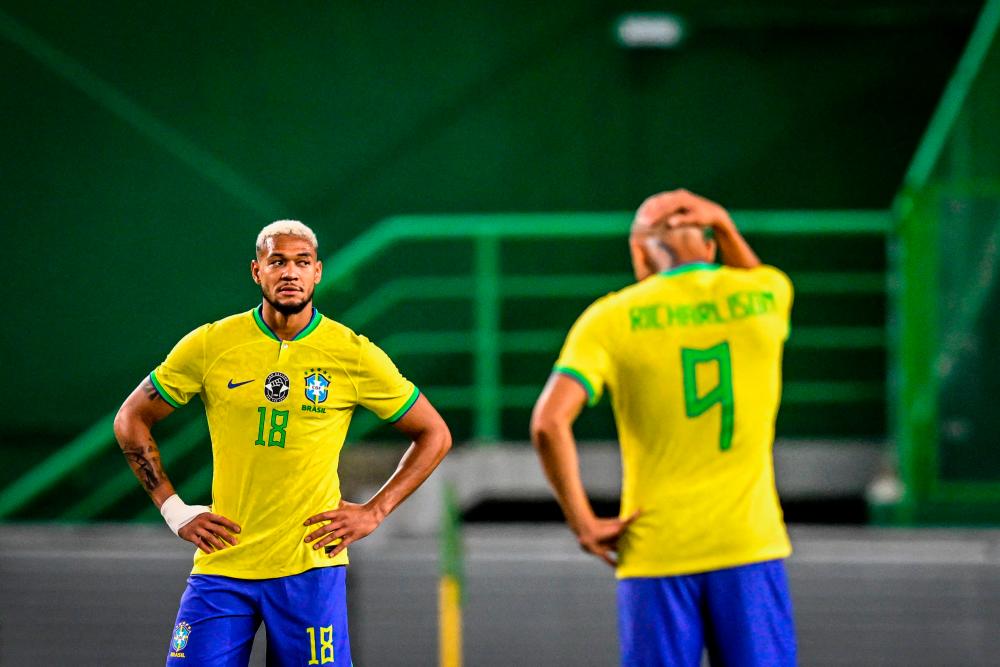 Brazil’s midfielder Joelinton Cassio and Brazil’s forward Richarlison (R) react after Senegal’s forward Sadio Mane scored during the international friendly football match between Brazil and Senegal at the Jose Alvalade stadium in Lisbon on June 20, 2023/AFPPix