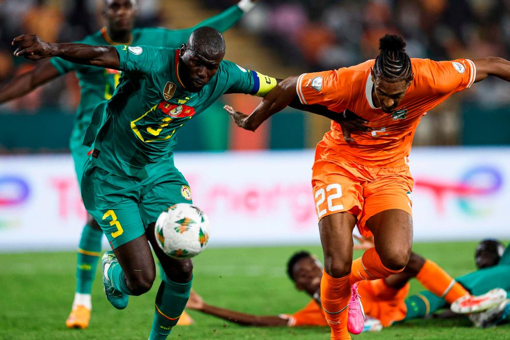 Senegal’s defender #3 Kalidou Koulibaly (L) fights for the ball with Ivory Coast’s forward #22 Sebastien Haller during the Africa Cup of Nations (CAN) 2024 round of 16 football match between Senegal and Ivory Coast at the Stade Charles Konan Banny in Yamoussoukro on January 29, 2024/AFPPix