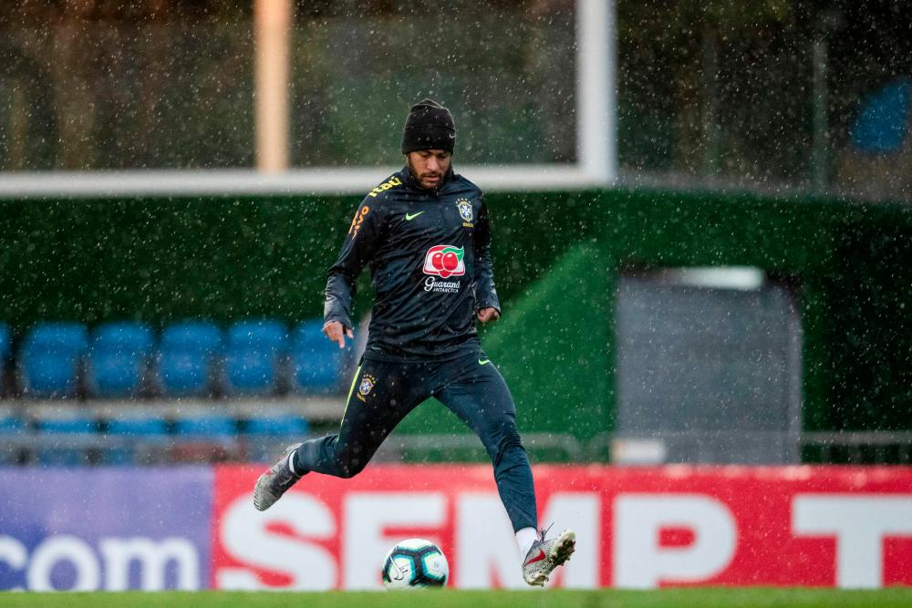Handout picture released by the Brazilian Football Confedertaion (CBF) showing Brazil's player Neymar during a training session at Granja Comary sport complex in Teresopolis, Brazil, on June 3, 2019, ahead of the Copa America football tournament. — AFP