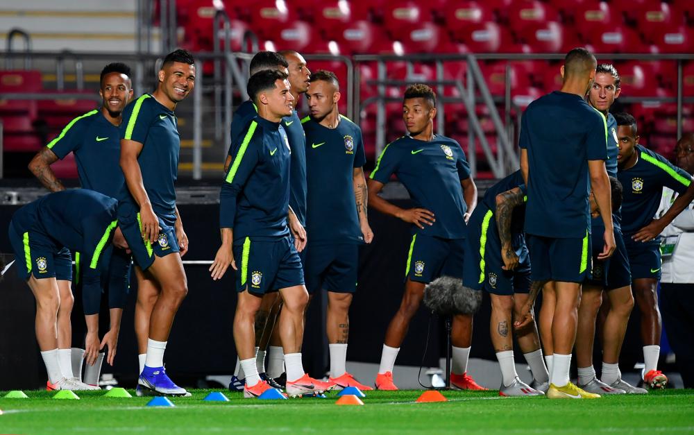 Brazilian players warm up during a training session at the Morumbi stadium, in Sao Paulo, Brazil, on June 13, 2019, ahead of the Copa America football tournament. — AFP