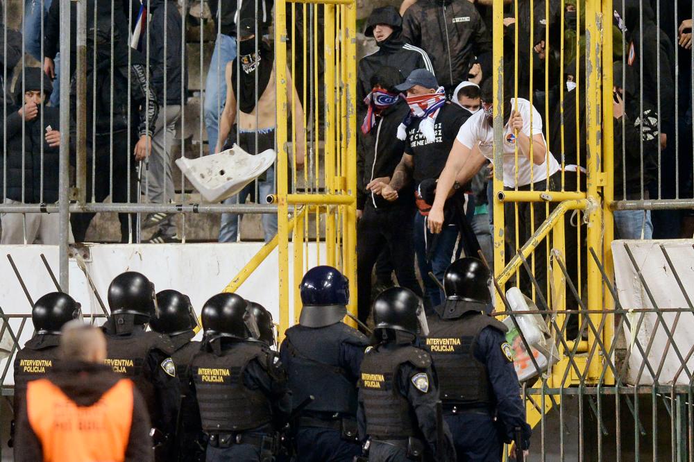 Members of Hajduk Split’s ultra fan base, known as the Torcida, clash with police at the Poljud stadium in Split on April 3, 2024/AFPPix