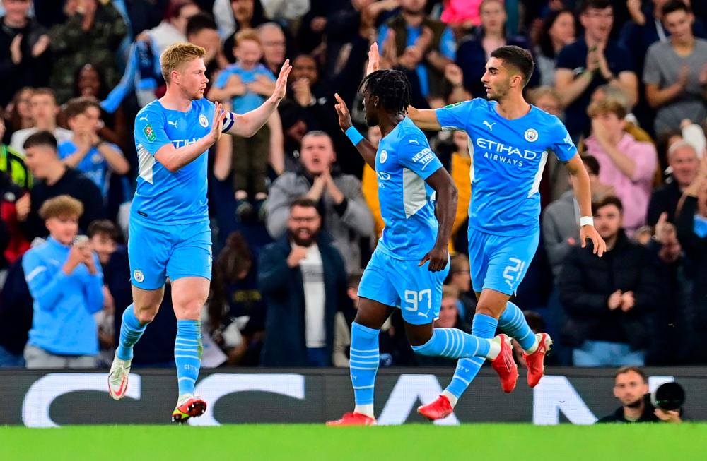 Manchester City’s Belgian midfielder Kevin De Bruyne celebrates scoring his team’s first goal during the English League Cup third round football match between Manchester City and Wycombe Wanderers – AFPPIX