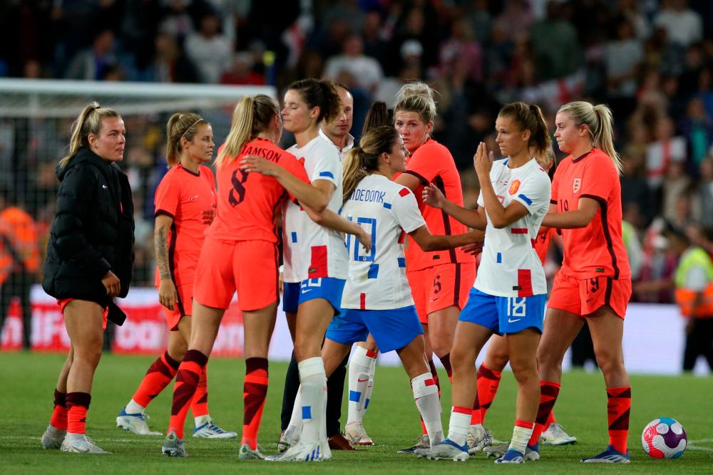 Players from both teams shake hands after the Women’s International friendly football match between England and Netherlands at Elland Road Stadium in Leeds, northern England on June 24, 2022. AFPPIX