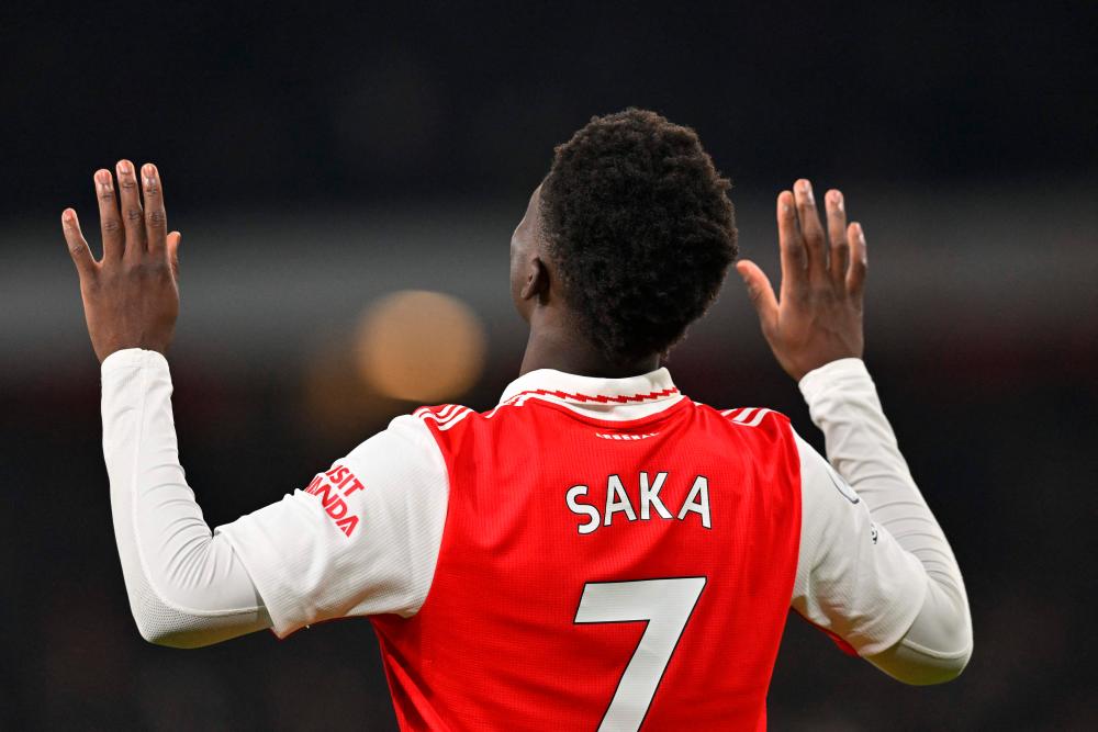 Arsenal’s English midfielder Bukayo Saka celebrates after scoring their second goal during the English Premier League football match between Arsenal and Manchester United at the Emirates Stadium in London on January 22, 2023. AFPPIX