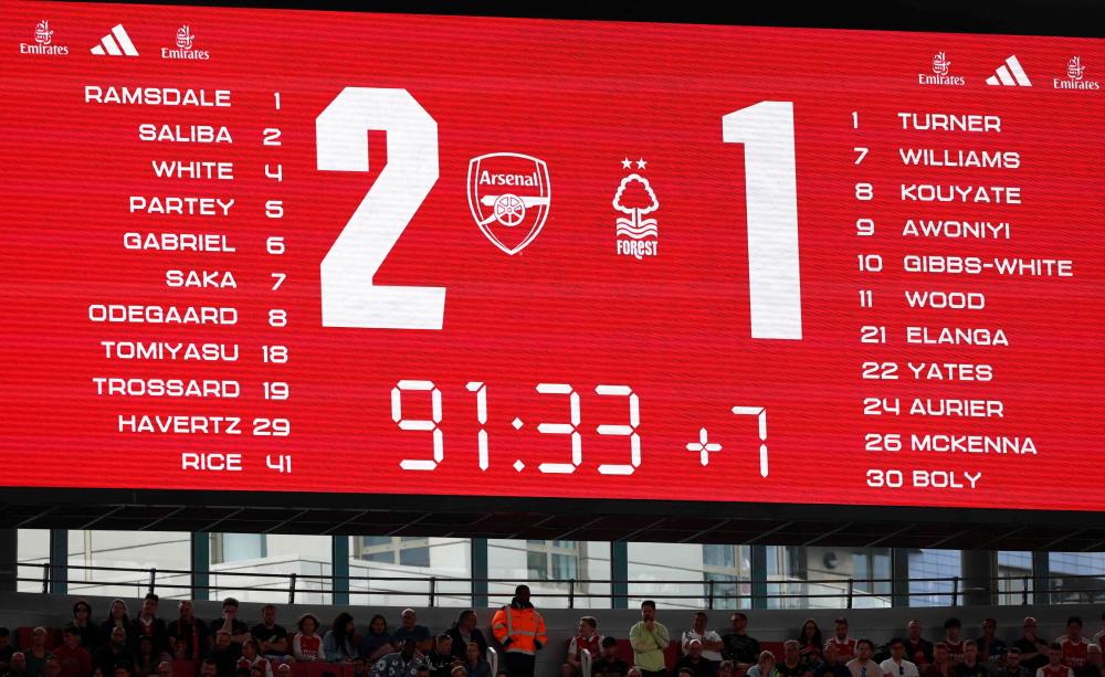 An electronic screen displays the 7 minutes of extra time in the second half of the English Premier League football match between Arsenal and Nottingham Forest at the Emirates Stadium in London on August 12, 2023. AFPPIX