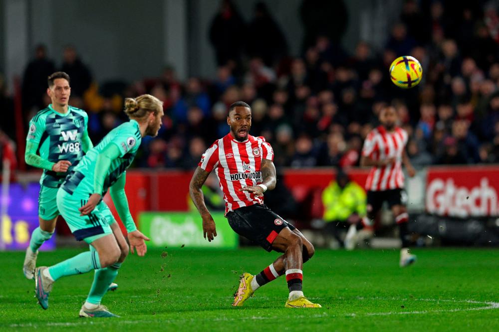 Brentford’s English striker Ivan Toney shoots from the centre circle and narrowly misses during the English Premier League football match between Brentford and Fulham at Gtech Community Stadium in London on March 6, 2023/AFPPix