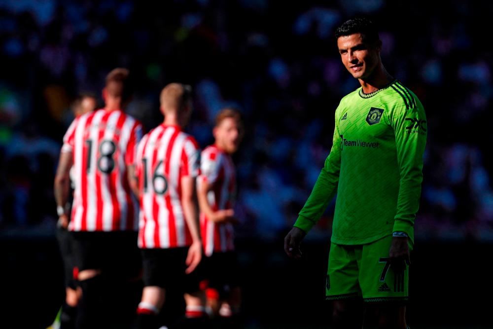 Manchester United's Portuguese striker Cristiano Ronaldo reacts after missing a chance during the English Premier League football match between Brentford and Manchester United at Brentford Community Stadium in London on August 13, 2022. AFPPIX