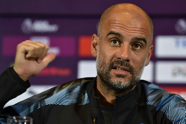 Coach for English Premier League club Manchester City, Pep Guardiola, takes part in a press conference one day before the final matches of the 2019 Premier League Asia Trophy football tournament in Shanghai on July 19, 2019. — AFP