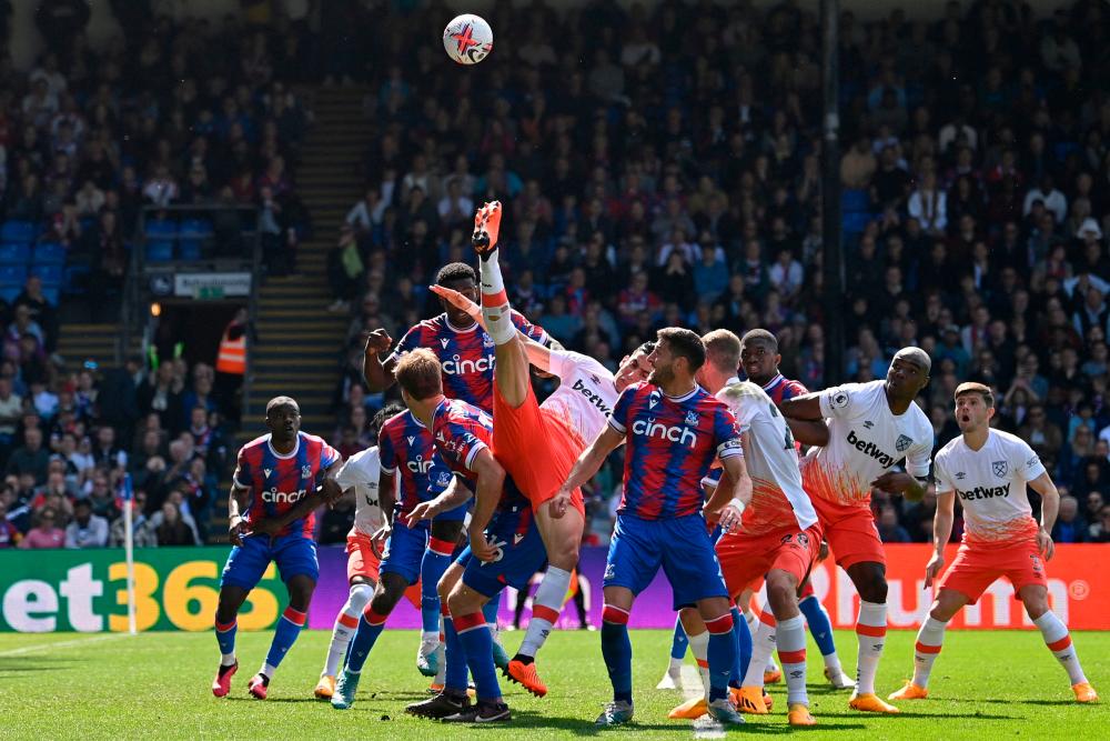 West Ham United’s Moroccan defender Nayef Aguerd (C) fails to connect with the ball during the English Premier League football match between Crystal Palace and West Ham United at Selhurst Park in south London on April 29, 2023. AFPPIX
