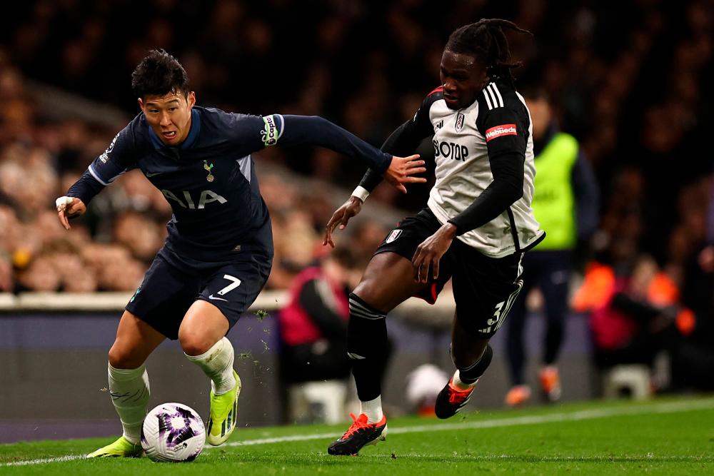 Tottenham Hotspur’s South Korean striker #07 Son Heung-Min (L) vies with Fulham’s Italian-born Nigerian defender #03 Calvin Bassey (R) during the English Premier League football match between Fulham and Tottenham Hotspur at Craven Cottage in London on March 16, 2024/AFPPix
