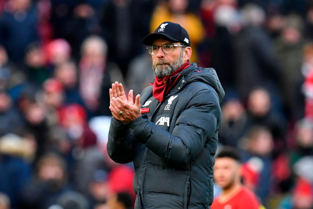 Liverpool's German manager Jurgen Klopp gestures at the final whistle during the English Premier League football match between Liverpool and Watford at Anfield in Liverpool, north west England on December 14, 2019. - AFP