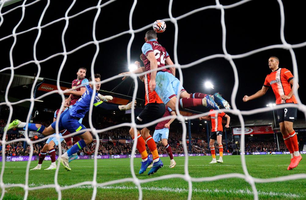 Soccer-Burnley beat Luton 2-1 for first league win of the season