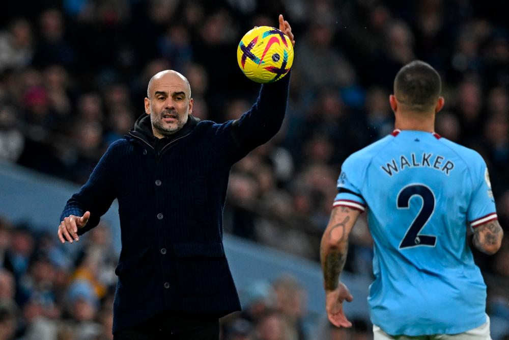 Manchester City’s Spanish manager Pep Guardiola collects the ball during the English Premier League football match between Manchester City and Aston Villa at the Etihad Stadium in Manchester, north west England, on February 12, 2023/AFPPix