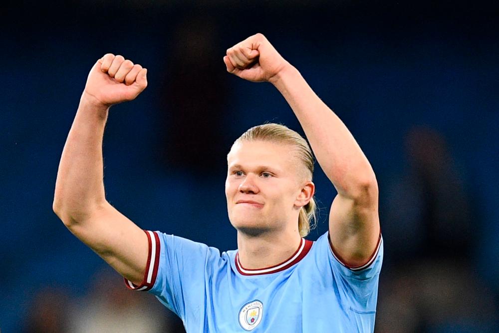 Manchester City’s Norwegian striker Erling Haaland celebrates the title of “most goal in a single season” at the end of the English Premier League football match between Manchester City and West Ham at the Etihad Stadium in Manchester, north west England, on May 3, 2023/AFPPix