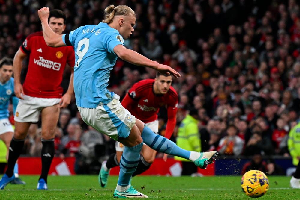 Manchester City’s Norwegian striker #09 Erling Haaland scores the opening goal from the penalty spot during the English Premier League football match between Manchester United and Manchester City at Old Trafford in Manchester, north west England, on October 29, 2023/AFPPix