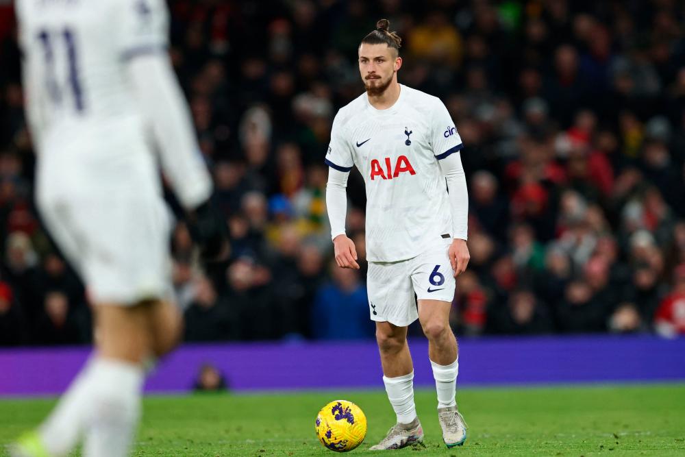 Tottenham Hotspur’s Romanian defender #06 Radu Dragusin makes his debut during the English Premier League football match between Manchester United and Tottenham Hotspur at Old Trafford in Manchester, north west England, on January 14, 2024/AFPPix