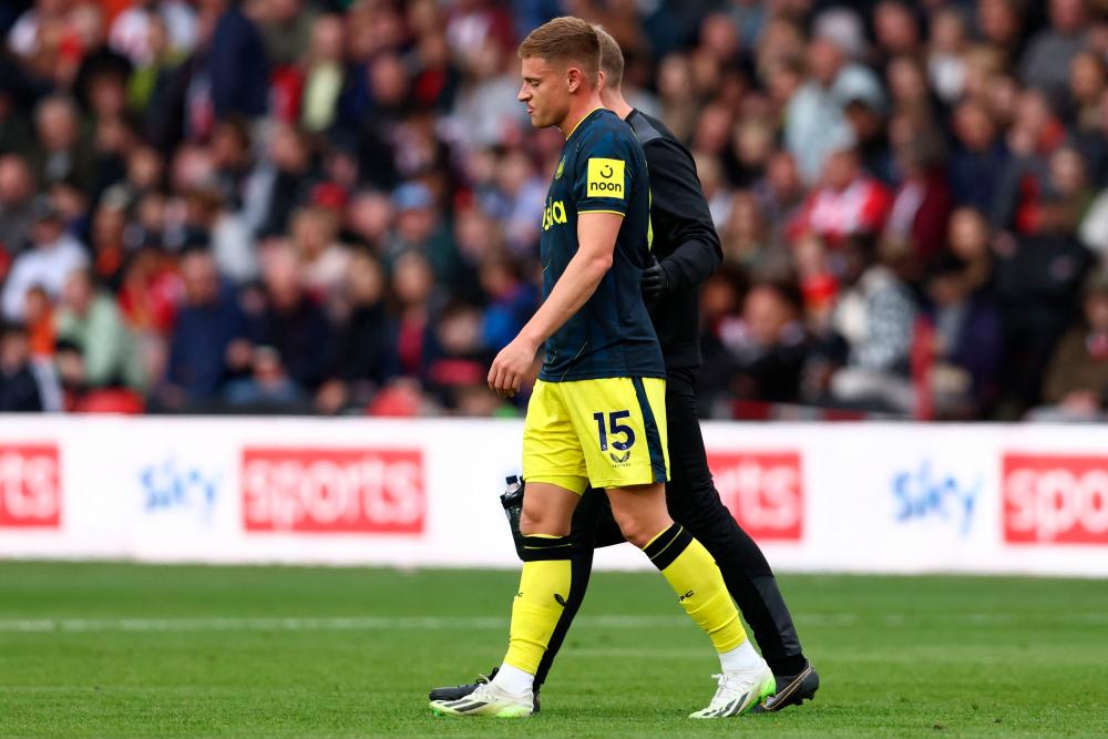Newcastle United’s English midfielder #15 Harvey Barnes is helped from the pitch after picking up an injury during the English Premier League football match between Sheffield United and Newcastle United at Bramall Lane in Sheffield, northern England on September 24, 2023/AFPpix