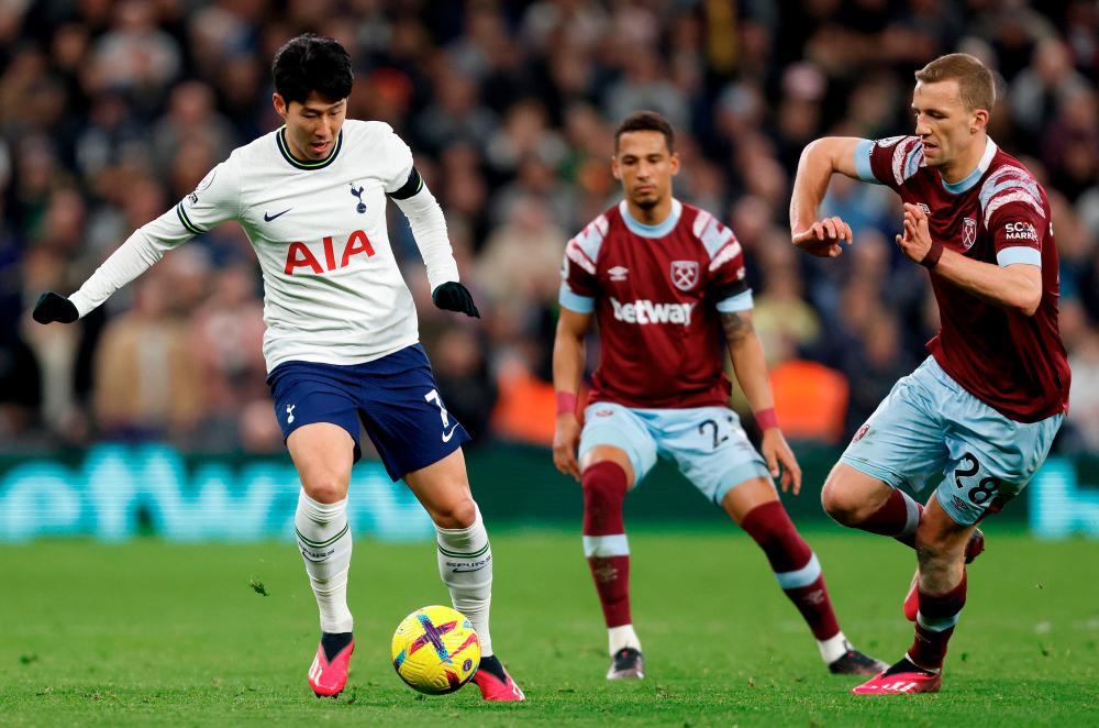 West Ham United's Tomas Soucek (R) vies with Tottenham Hotspur's South Son Heung-Min during the English Premier League football match between Tottenham Hotspur and West Ham United at Tottenham Hotspur Stadium in London, on February 19, 2023. AFPPIX