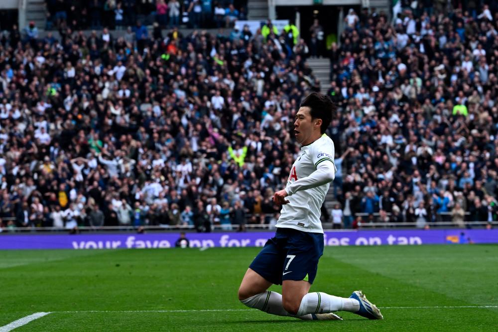 Tottenham Hotspur's South Korean striker Son Heung-Min celebrates after scoring the opening goal of the English Premier League football match between Tottenham Hotspur and Brighton and Hove Albion at Tottenham Hotspur Stadium in London, on April 8, 2023. AFPPIX