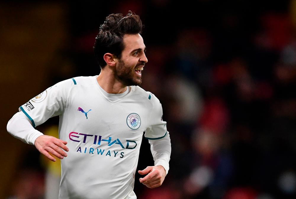 Manchester City's Portuguese midfielder Bernardo Silva celebrates scoring his team's third goal during the English Premier League football match between Watford and Manchester City at Vicarage Road Stadium in Watford on December 4, 2021. AFPpix