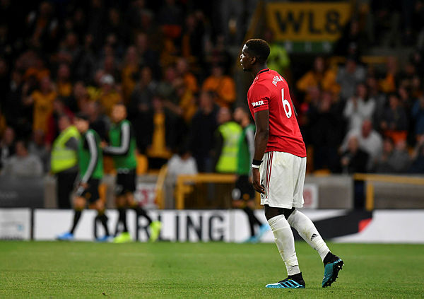 Manchester United’s French midfielder Paul Pogba reacts after his penalty shot was saved during the English Premier League football match between Wolverhampton Wanderers and Manchester United at the Molineux stadium in Wolverhampton, England on Aug 19, 2019. — AFP