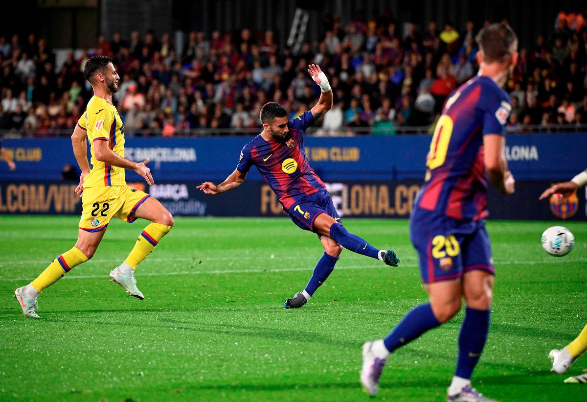 Barcelona’s forward Ferran Torres scores his team’s first goal during the Spanish league football match between FC Barcelona and Getafe CF at Johan Cruyff Stadium in Barcelona on September 21, 2025. - AFP