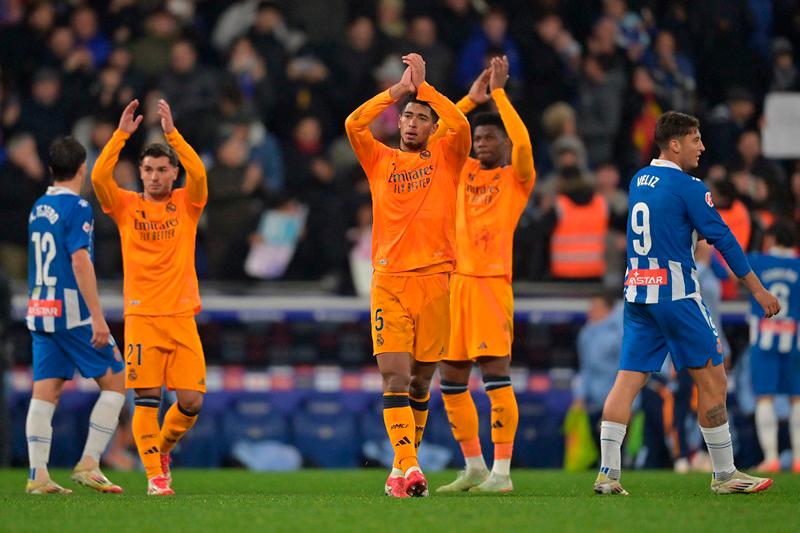 Real Madrid's Moroccan forward #21 Brahim Diaz (L)and Real Madrid's English midfielder #05 Jude Bellingham react after the Spanish league football match between RCD Espanyol and Real Madrid CF at the RCDE Stadium in Cornella de Llobregat on February 1, 2025. - MANAURE QUINTERO / AFP