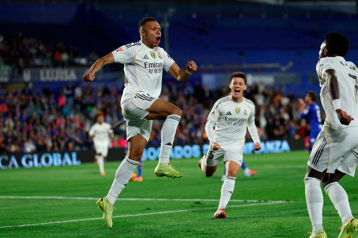 Real Madrid’s French forward #10 Kylian Mbappe celebrates scoring his team’s first goal during the Spanish league football match between Getafe CF and Real Madrid CF at Coliseum Alfonso Perez Stadium. - Thomas COEX / AFP