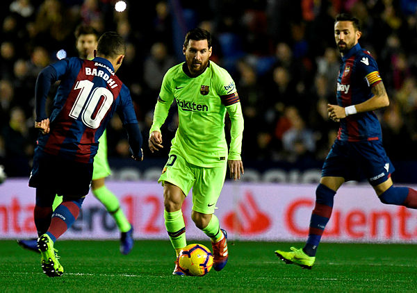 Levante’s Macedonian midfielder Enis Bardhi (L) vies with Barcelona’s Argentinian forward Lionel Messi during the Spanish League football match between Levante and Barcelona at the Ciutat de Valencia stadium in Valencia on Dec 16, 2018. — AFP