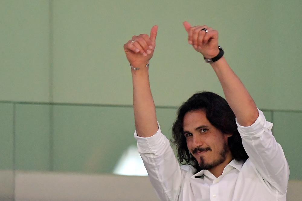 Former Manchester United striker Edinson Cavani gestures to the crowd as he attends the Spanish League football match between Valencia CF and Club Atletico de Madrid at the Mestalla stadium in Valencia on August 29, 2022. AFPPIX