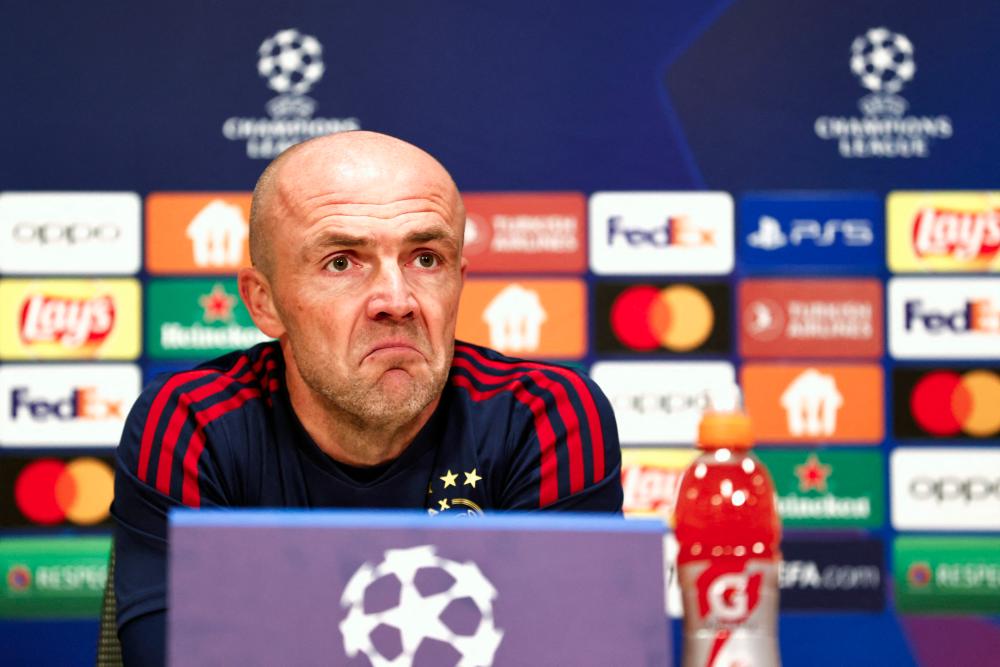 Ajax's Dutch head coach Alfred Schreude speaks during a press conference prior to the UEFA Champions League match between Ajax Amsterdam and SSC Napoli, Group A, football match at the Johan Cruijff ArenA in Amsterdam on October 3, 2022. - AFPPIX