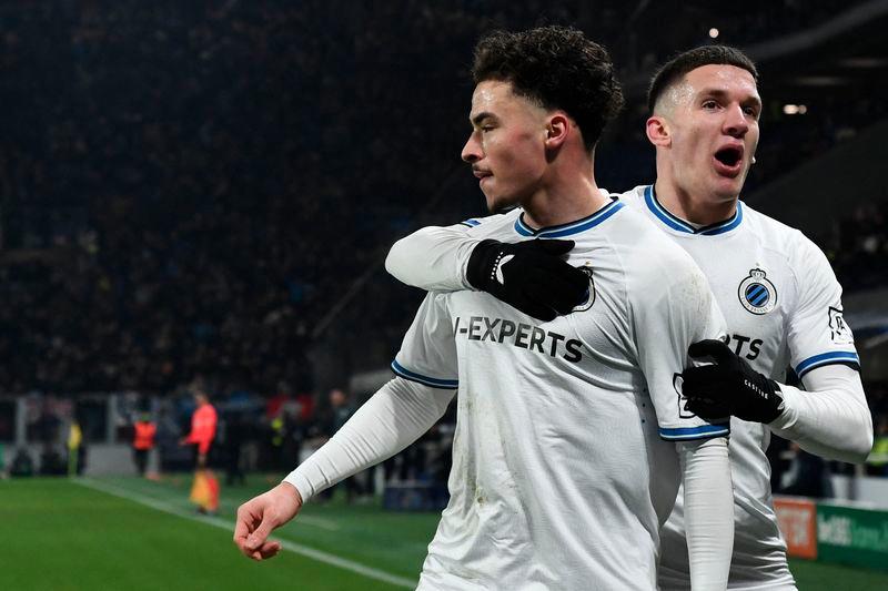 Club Brugge's Belgian midfielder #68 Chemsdine Talbi (L) celebrates scoring his team's second goal with Club Brugge's Greek forward #08 Christos Tzolis during the UEFA Champions League knockout phase play-off 2nd leg football match between Club Brugge KV and Atalanta at the Stadio di Bergamo in Bergamo on February 18, 2025. - AFPPIX