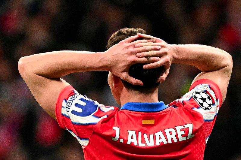 Atletico Madrid's Argentine forward #19 Julian Alvarez reacts during the UEFA Champions League Round of 16 second leg football match between Club Atletico de Madrid and Real Madrid CF at the Metropolitano stadium in Madrid on March 12, 2025. - AFPPIX