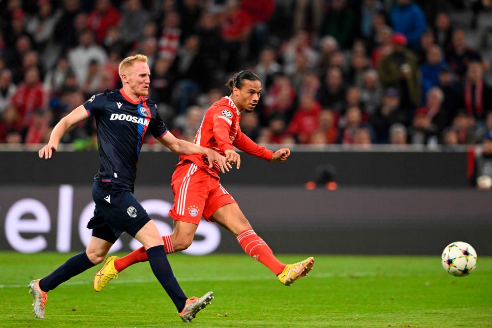 Bayern Munich’s German midfielder Leroy Sane (R) scores his team’s fourth goal 4:0 during the UEFA Champions League Group C football match FC Bayern Munich vs FC Viktoria Plzen, in Munich, southern Germany, on October 4, 2022. AFPPIX