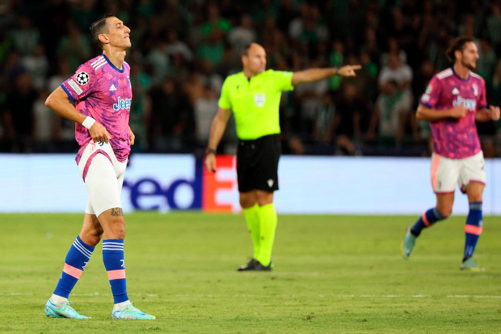 Juventus’ Argentine forward Angel Di Maria (L) reacts after picking up an injury during the UEFA Champions League group H football match between Israel’s Maccabi Haifa and Italy’s Juventus at the Sammy Ofer stadium in the city of Haifa on October 11, 2022. AFPPIX
