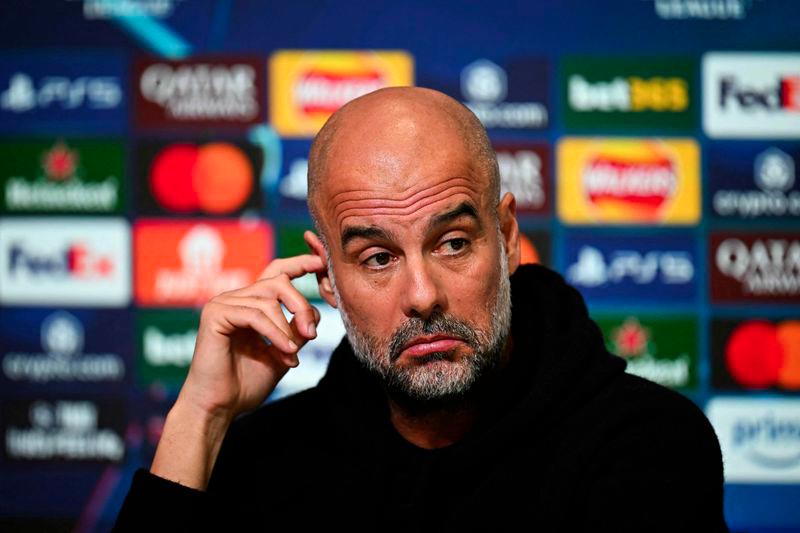 Manchester City's Spanish manager Pep Guardiola reacts as he speaks during a press conference at Manchester City's training ground in Manchester, north-west England, on February 10, 2025, on the eve of their UEFA Champions League football match against Real Madrid. - AFPPIX