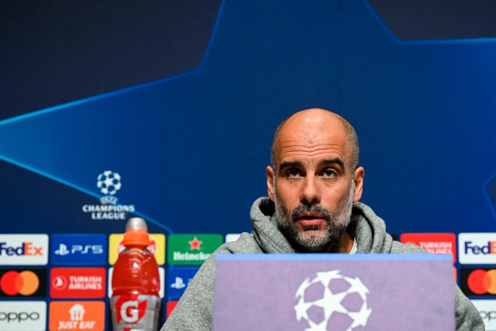 Manchester City’s Spanish manager Pep Guardiola reacts as he attends a press conference at Manchester City training ground in Manchester, north-west England on March 13, 2023, on the eve of their UEFA Champions League round of 16 second-leg football match against RB Leipzig/AFPPix