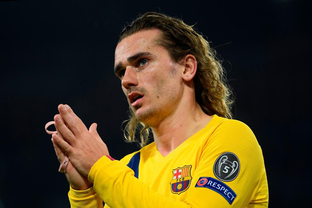 Barcelona's French forward Antoine Griezmann reacts during the UEFA Champions League round of 16 first-leg football match between SSC Napoli and FC Barcelona at the San Paolo Stadium in Naples on Feb 25. — AFP