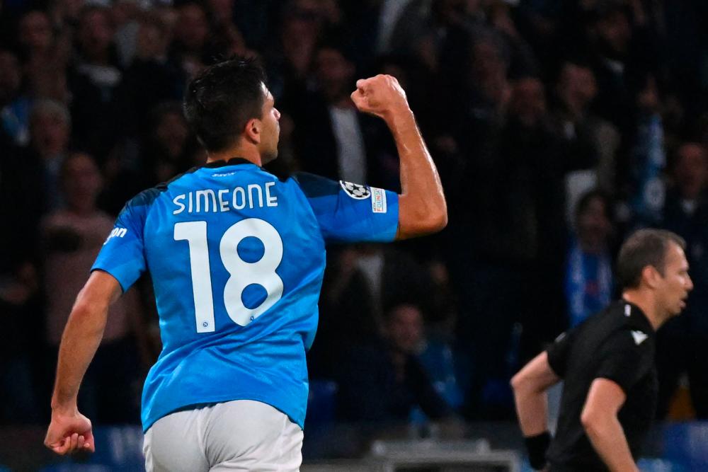 Napoli’s Argentinian forward Giovanni Simeone celebrates after scoring a goal during the UEFA Champions League Group A second leg football match between SSC Napoli and Rangers FC at the Diego Armando Maradona Stadium in Naples on October 26, 2022. AFPPIX
