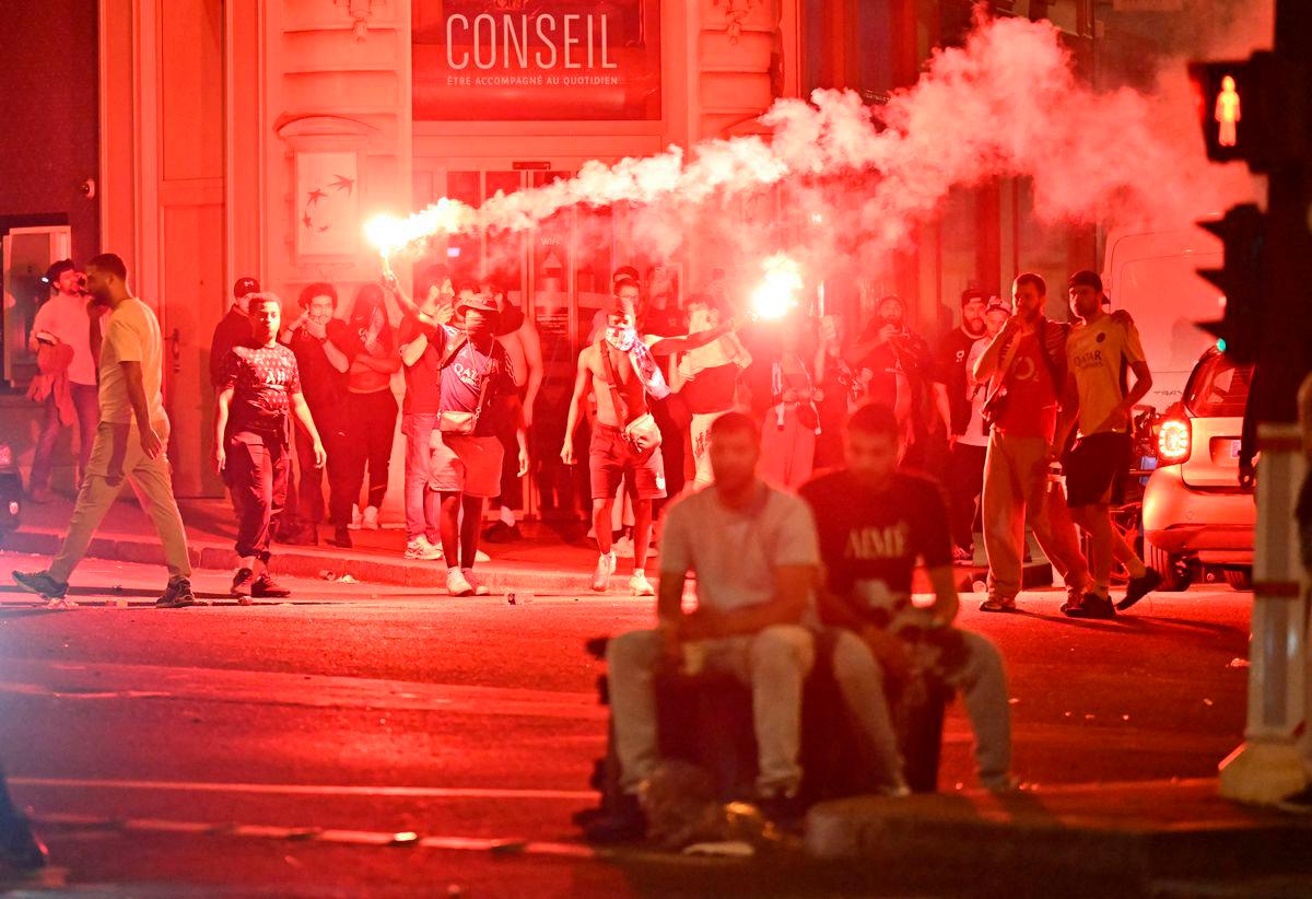 Paris Saint-Germain (PSG) supporters gather holding flares on a street in Paris early June 1, 2025, during celebrations following their 5-0 victory in the UEFA Champions League final football match between Paris Saint-Germain (PSG) and Inter Milan held in Munich.. AFPpix