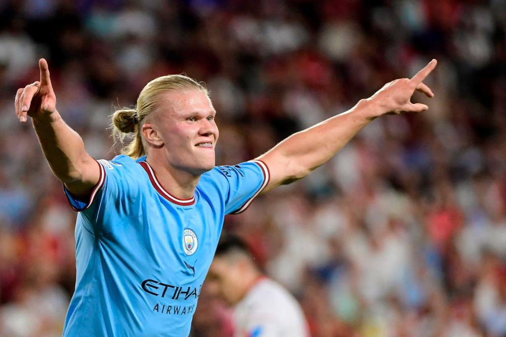 Manchester City’s Norwegian striker Erling Haaland celebrates after scoring his team’s third goal during the UEFA Champions League Group G first-leg football match between Sevilla FC and Manchester City, at the Ramon Sanchez Pizjuan stadium in Seville on September 6, 2022. AFPPIX